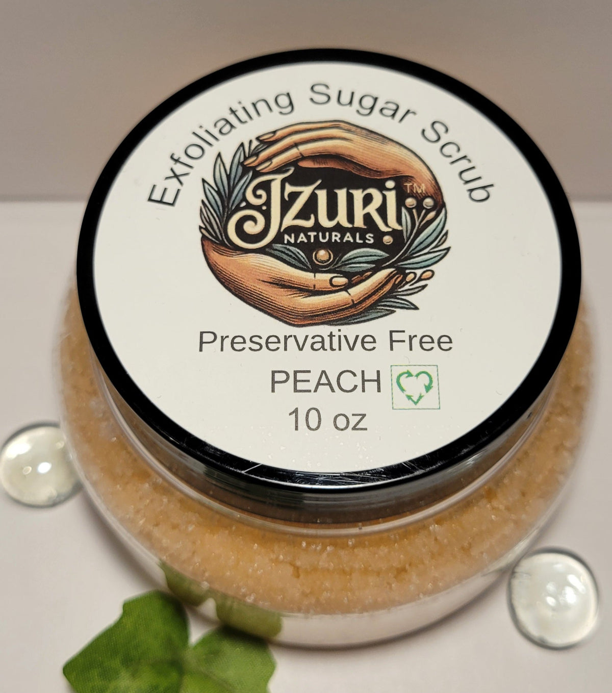 Jar of J'Zuri Naturals Exfoliating Sugar Scrub with the brand's label